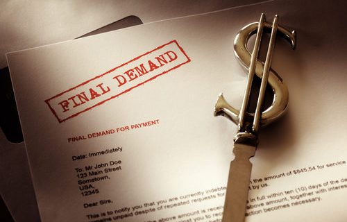 The words "final demand" stamped on a paper