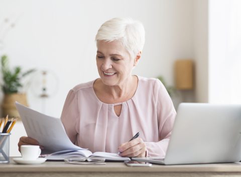 retired woman reviewing finances