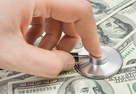 Stethescope being applied to money