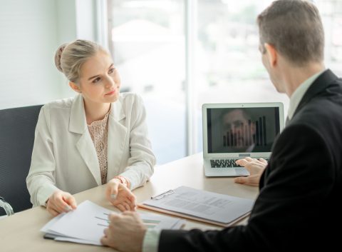 man and woman discussing consolidating debt