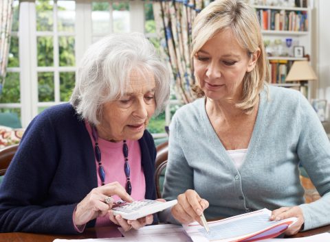 two women working to reduce credit card debt