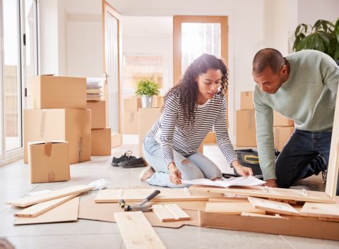 A couple making home modifications on their own to save money.