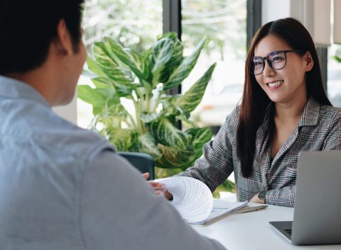 Employer or recruiter reading a resume during about colloquy his profile of candidate, employer conducting a job interview, manager resource employment and recruitment concept.