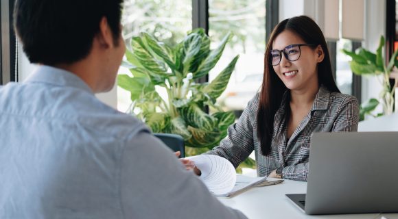 Employer or recruiter reading a resume during about colloquy his profile of candidate, employer conducting a job interview, manager resource employment and recruitment concept.