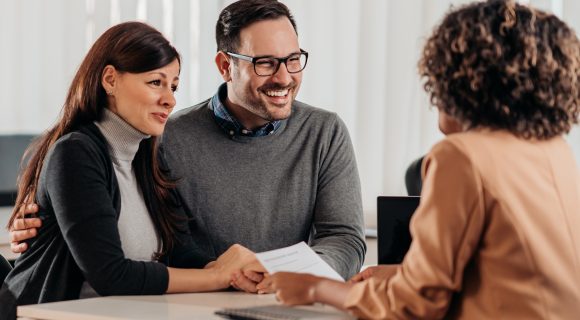 husband and wife meeting with banker