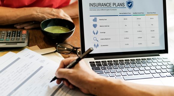 Person enrolling for health insurance on computer