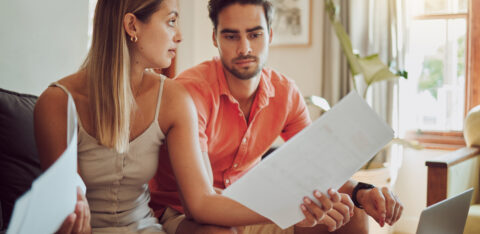 Couple with debt looking at bills