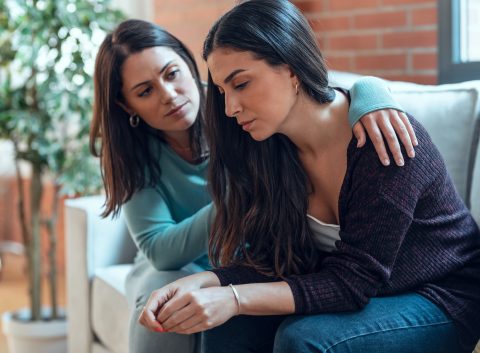 woman comforting her friend