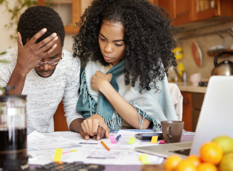 a couple looking over bills